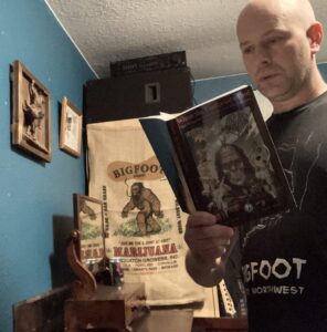 Holding a Bigfoot book reading